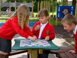 children using a playground games table