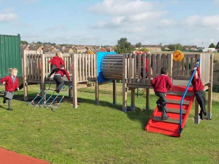 children using new climbing playground equipment at Glade Hill Primary School