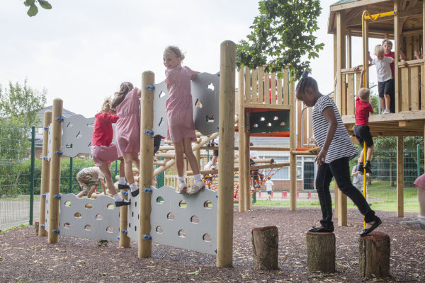 children using a playground traverse wall
