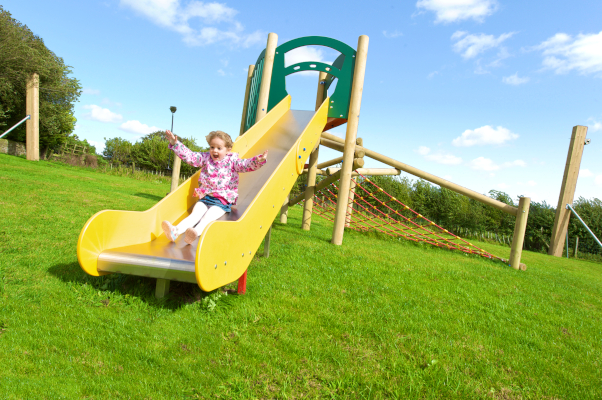 girl on a playground slide